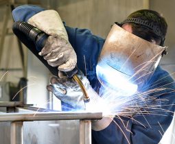 welder works in metal construction - construction and processing of steel components